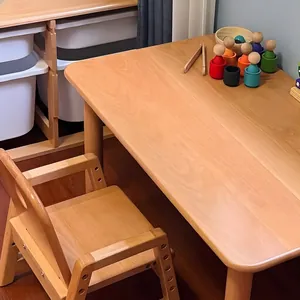 Adjustable solid wood desk and chair set for children with a minimalist natural finish