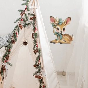 Sticker mural cerf de Noël avec nœud floral dans une chambre d'enfant style nordique