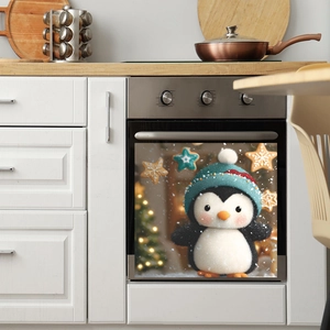 Christmas dishwasher magnet cover featuring a cute penguin and festive holiday tree decor