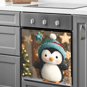 Christmas dishwasher sticker featuring a cute penguin in a teal hat with snow scene