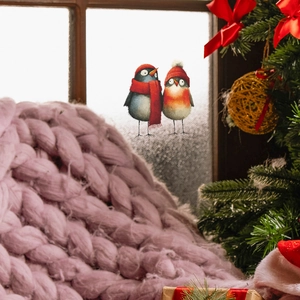 Christmas window decals with cute cartoon birds in festive winter scarves on glass