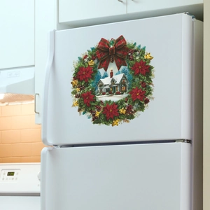 Christmas wreath wall sticker with a snowy house design on a white refrigerator