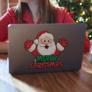 Sticker Père Noël Merry Christmas pour mur et ordinateur portable sur un PC gris
