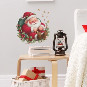 Christmas wall sticker featuring a cute sleeping Santa Claus with holly leaf decorations