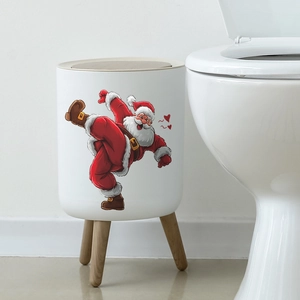 White Christmas trash can with wooden legs featuring a Santa Claus print in a bathroom