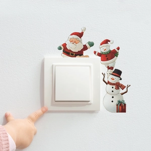 Autocollants de Noël avec Père Noël et bonhomme de neige autour de l'interrupteur