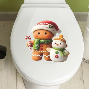 Christmas toilet lid stickers featuring a gingerbread man and snowman in a cozy bathroom