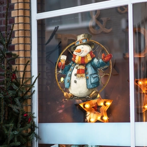 Steampunk snowman window decal with goggles and wine glass in a festive gear frame