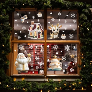 Christmas window decals set with Santa, reindeer, and snowy house on glass surface