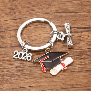 2026 Graduation keychain with black enamel mortarboard and silver graduate charm