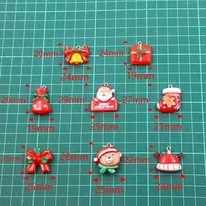 Assorted Christmas resin pendants featuring Santa, reindeer and bells with metal loops