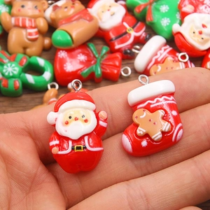 Assorted Christmas resin pendants featuring Santa Claus and gingerbread man with metal loops