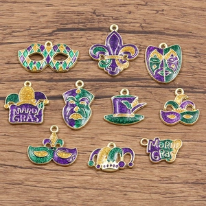 Detailed view of Mardi Gras enamel pendants with glitter on rustic wooden background