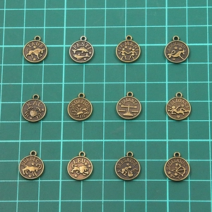 Set of 12 vintage bronze zodiac coin pendants for DIY jewelry making and necklaces