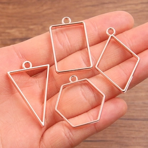 Rose gold geometric pendants in various shapes including rectangle and hexagon for DIY crafts
