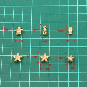 Golden stainless steel sea animal charms including turtle, seahorse and fish for DIY jewelry