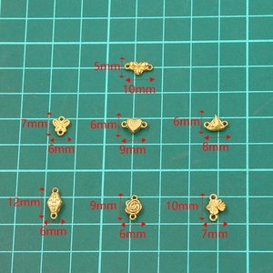 Gold-plated 304 stainless steel jewelry connectors in floral and butterfly shapes