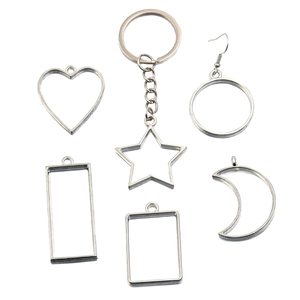 Silver hollow alloy frames in heart moon and star shapes for DIY resin jewelry making