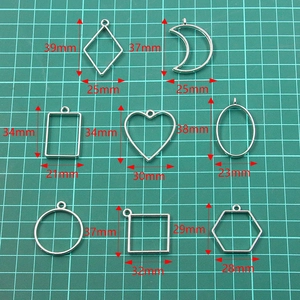 Set of 8 silver alloy geometric hollow frames for DIY resin jewelry pendants