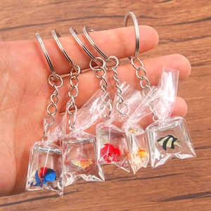 Five unique resin goldfish in transparent bags as realistic creative keychains