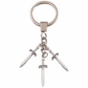 Vintage silver dagger charm keychain featuring three alloy sword pendants on a white background