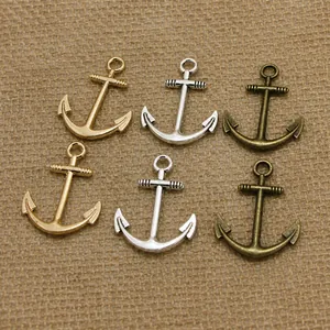 Three colors of DIY anchor pendants in gold, silver and bronze for jewelry making