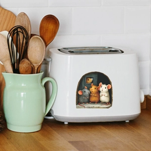 3D mouse hole wall sticker featuring three cute mice applied on a white toaster