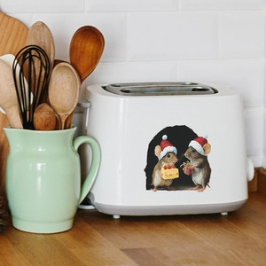 Detailed view of Christmas mouse stickers applied on a white kitchen bread machine