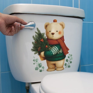 Cartoon Christmas bear wall sticker with tree on a bathroom toilet tank lid