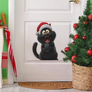 Sticker mural 3D chat noir de Noël avec bonnet de Père Noël utilisant un téléphone