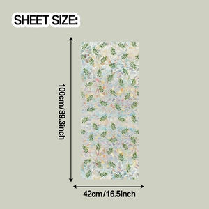 Detail view of rainbow window film with green leaves and geometric texture, 100x42cm sheet