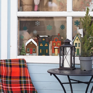 Christmas snowy town window stickers with colorful houses and snowflakes for holiday decor
