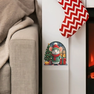 Detail view of festive mouse wall sticker with a Christmas tree and gifts in home setting