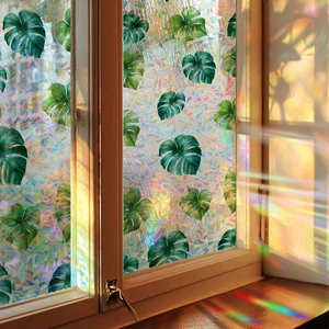 Rainbow window film with monstera leaves for privacy and colorful light refraction