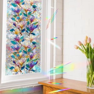 Stained glass window film with magnolia flower patterns creating rainbow light effects