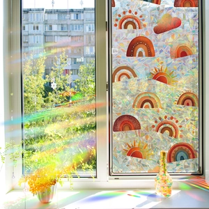 Rainbow window film with sun and cloud patterns creating a bohemian decorative light effect