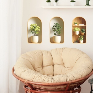 Minimalist Papasan chair with thick beige cushion and dark brown woven rattan base for home