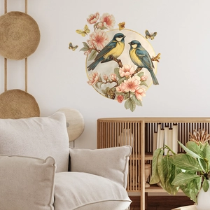 Floral wall decal with blue birds and pink cherry blossoms in a minimalist home setting