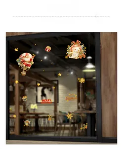 Detail view of festive Santa Claus and snowflake static stickers on a glass window