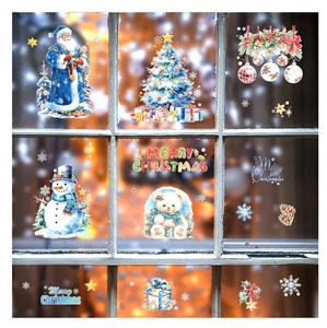 Detail of Christmas window stickers featuring Santa, snowman and decorated tree on glass