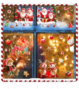 Detail of Christmas window stickers featuring Santa, reindeer, and snowflakes decorations