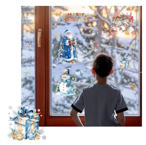 Detail view of festive snowman and Santa glass window stickers in a cozy home setting