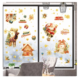Detail of Christmas window clings featuring Santa, reindeer, and gingerbread house patterns