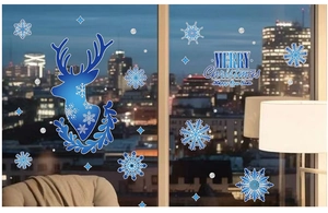 Close-up of blue reindeer silhouettes and snowflake window stickers for Christmas decor