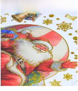 Detail of Christmas window sticker with glittery Santa Claus and golden snowflake patterns