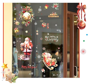 Détail d'autocollants de Père Noël vintage et de traîneau rouge pour fenêtres en verre