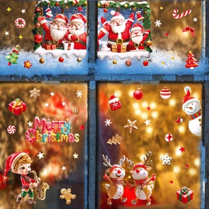 Christmas window stickers featuring Santa, reindeer and snowflakes for holiday glass decor