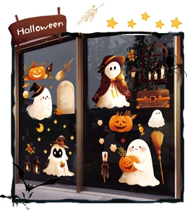 Detail of Halloween window clings featuring ghosts, pumpkins, and bats on glass surface