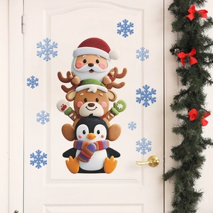 Christmas wall stickers with Santa, reindeer and penguin stacking on a white door