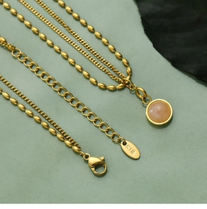 Detailed close-up of 18K gold-plated double-layer necklace with K18 engraving